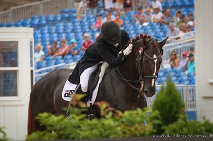Alexis Hellyer gives Bluefields Floreno a pat after their Grand Prix - © Michelle Terlato