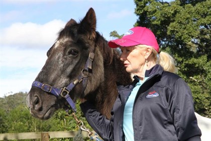 Calypso with his carer, Jenny Dyson-Holland, at a property on the Gold Coast hinterland. © ABC Gold Coast: Tom Forbes