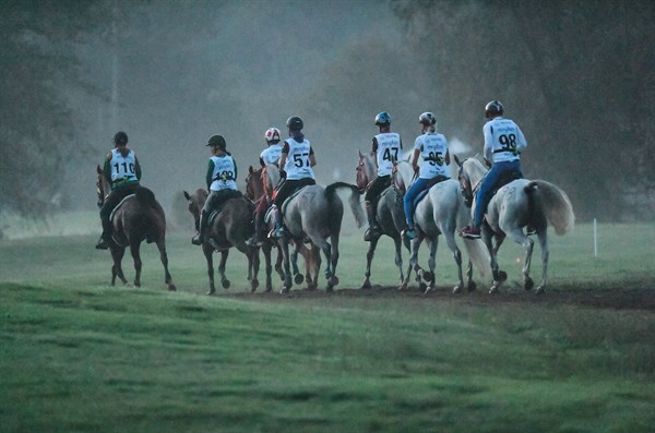 Endurance riders canter after the start at WEG - © FEI/MARTIN DOKOUPIL