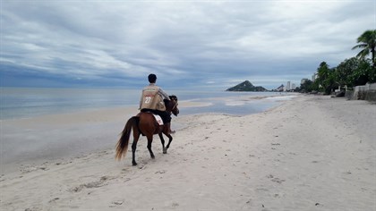 Horse riding on the beach in Thailand.