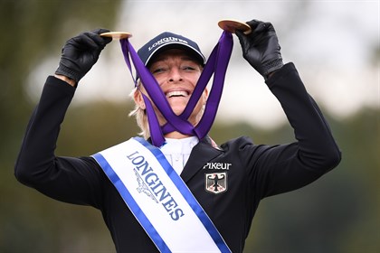 Ingrid Klimke celebrates with her two gold medals at the Longines FEI Eventing European Championships 2019 © Oliver Hardt/Getty Images for FEI
