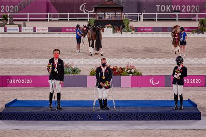 Pepo Puch (AUT) silver, Lee Pearson (GBR) gold, and Georgia Wilson (GBR) bronze on the podium at the grade 2 individual medal ceremony. © FEI/Liz Greg