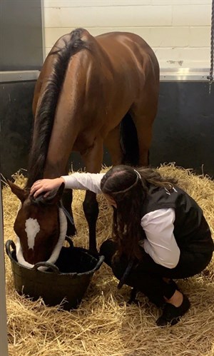 Rostropvich receiving some love from his strapper Alice Barnett © Lindsay Park Racing twitter page