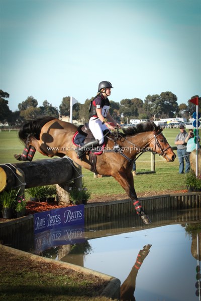 Sophie Negre on Card Sharp jump the Bates Water Complex in the CCI1* © Michelle Terlato